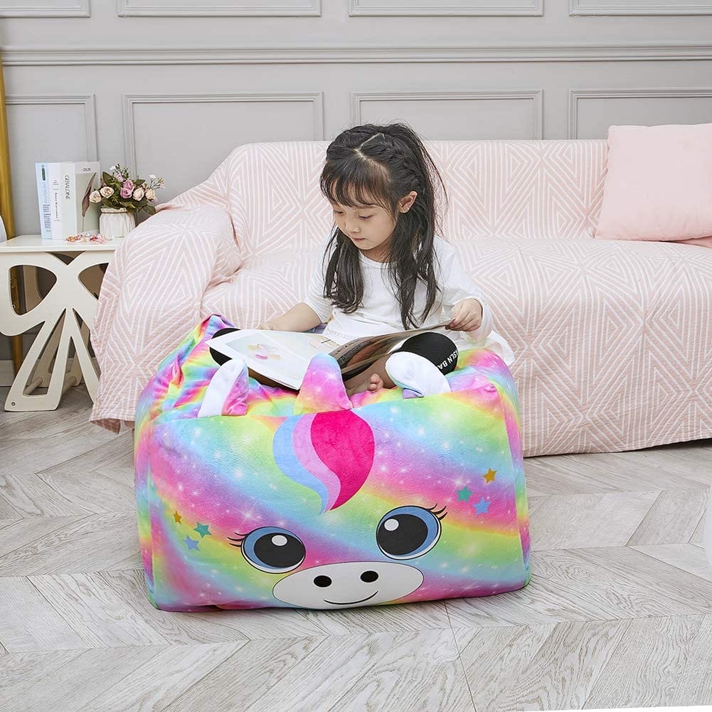 child sitting on stuffed animal beanbag chair