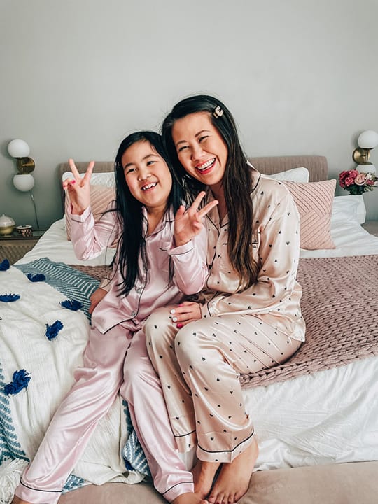 Mommy and daughter in matching silk pajamas