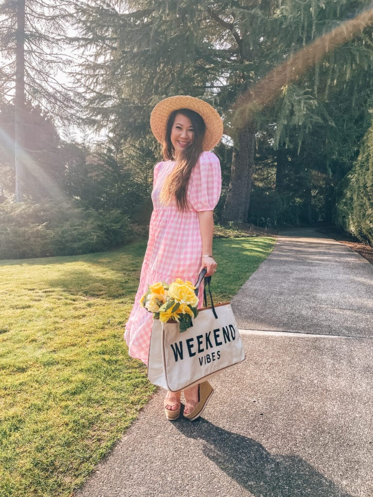girl in pink gingham maxi dress with weekend tote