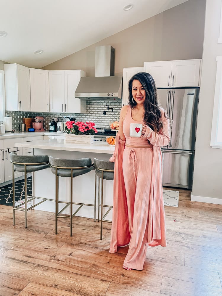 girl in kitchen wearing pink loungewear