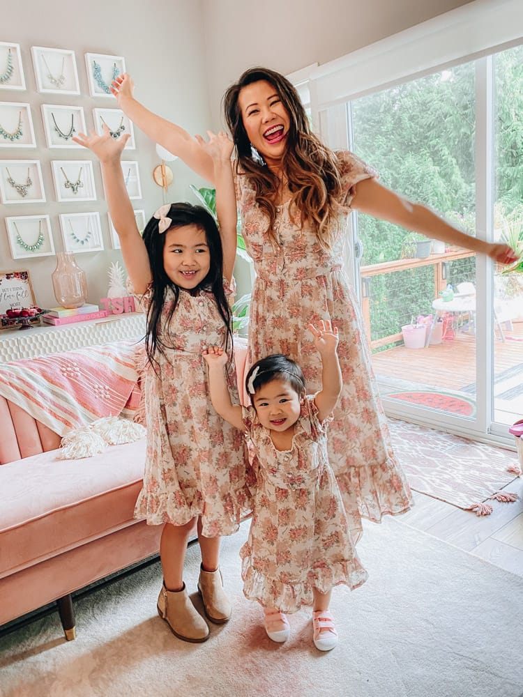 mom and daughters in matching floral dresses
