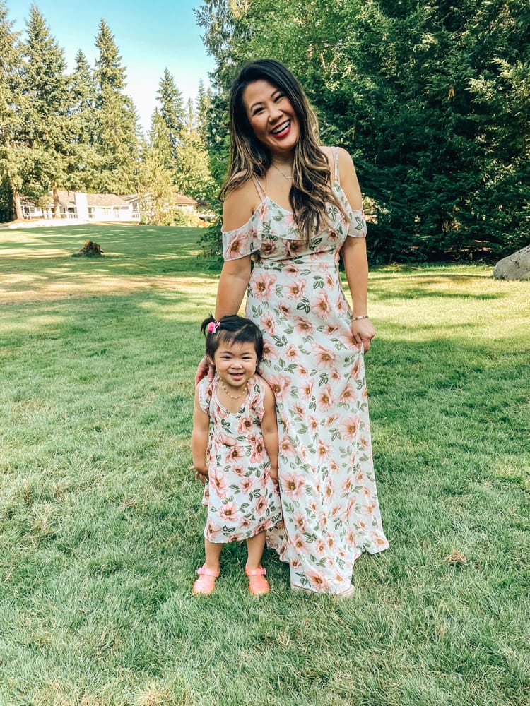 mom and daughter in matching floral dresses