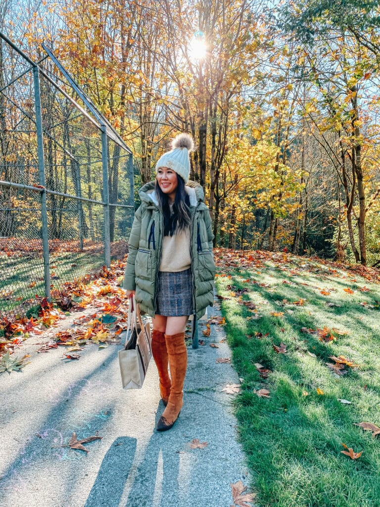 fall weather and girl in fall outfit wearing a sweater, skirt and jacket